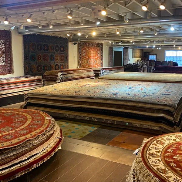 rugs on display inside Pars Oriental Rugs store